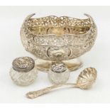 An Edwardian boat shaped silver sugar basin, reticulated border above body chased with floral and