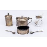 A George VI silver three piece plain condiment set comprising mustard pot, salt and pepper, with