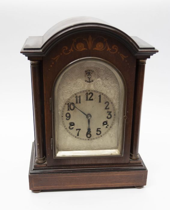 Early 20th century 8 day chiming mahogany mantle clock with inlay detail silvered face Arabic