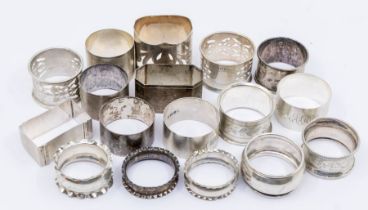 A collection of mainly late 19th/early 20th Century silver napkin rings, various designs, dates