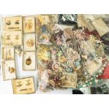 A collection of costume jewellery to include plastic bead and faux pearl necklaces, gilt metal