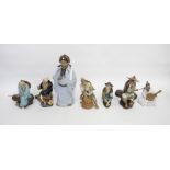 Seven various 20th Century glazed earthenware figures of Chinamen (8)