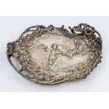 A late 19th Century Continental (Hanau) silver ornate serving dish, the centre chased with Putto