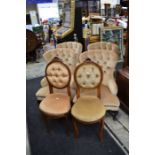Two mid-20th Century button back armchairs along with two button back bedroom chairs