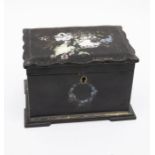 An 18th century black papier-maché two compartment tea caddy with hand-painted floral detail