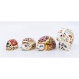 A group of four Royal Crown Derby paperweights to include:  1. Bramble (Hedgehog), medium, gold
