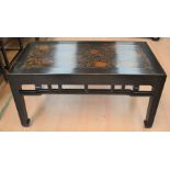 An ebonised coffee table in the Oriental style
