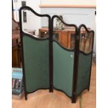 A Victorian mahogany room screen with glass panels and green fabric, scrolled top