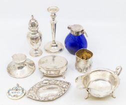 A George VI silver sauce boat, Sheffield 1938; a George V silver pepperette, London 1911; an
