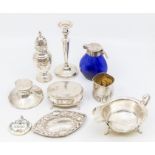 A George VI silver sauce boat, Sheffield 1938; a George V silver pepperette, London 1911; an