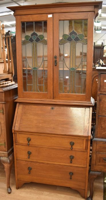 1930s light oak bureau Bookcase with stained glass cupboard doors to reveal three bookshelves, and a