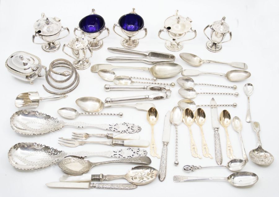 An Edwardian silver matched six piece condiment set comprising: pair of salts, mustard pot and