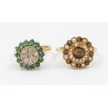 An emerald and diamond 18ct gold cluster ring round form, claw set to the centre with round