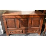 Early 18th century oak mule chest with a panel front above two single base drawers and brass swing