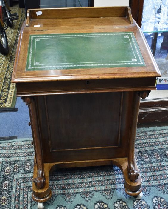 Late 19th century mahogany Davenport with four side drawers and four dummy drawers. It is on bun
