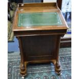 Late 19th century mahogany Davenport with four side drawers and four dummy drawers. It is on bun