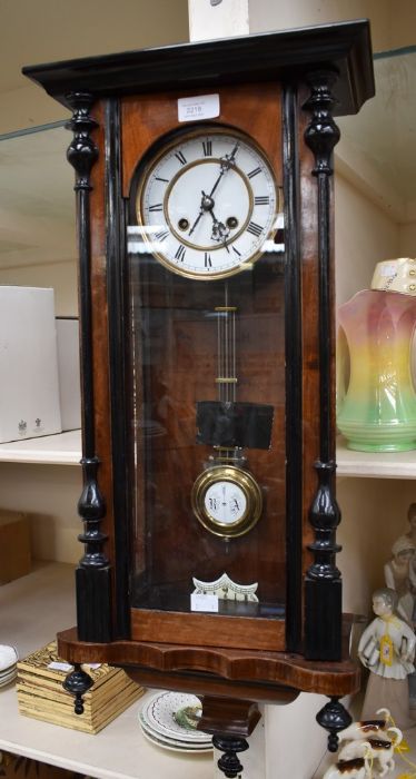 A Vienna wall clock with 5" two piece dial, spring driven two train movement, chiming on a gong,