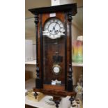 A Vienna wall clock with 5" two piece dial, spring driven two train movement, chiming on a gong,