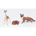 Three John Beswick figures, two foxes and a giraffe