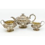 A George IV silver three-piece tea set hallmarked by George Burrows, London, 1824 - vine and