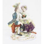 19th century Continental porcelain figure of a man and woman, with gold anchor mark of Chelsea but