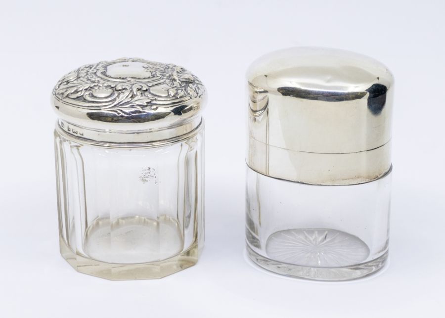 An early Edwardian large plain oval glass and silver mounted scent bottle, hallmarked by Alexander