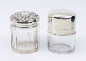 An early Edwardian large plain oval glass and silver mounted scent bottle, hallmarked by Alexander