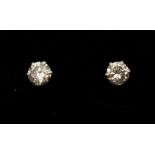 A pair of small round brilliant cut diamond studs, claw set, total diamond weight approx 0.20ct,