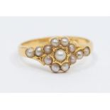 A Victorian pearl set 18ct gold ring, comprising a cluster of half pearls to the centre width approx