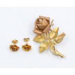 A 14ct  gold rose spray brooch, comprising a rose gold rose and bud with yellow gold leaf