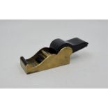 A steel soled brass chariot plane, with ebony infill and wedge, sole 4 1/16in. x 1 3/4in.