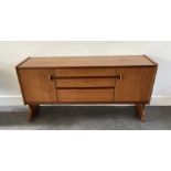 A mid century sideboard table and similar