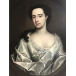 Circle of Godfrey Kneller (1646-1723), an 18th century half length portrait of a young lady, oil