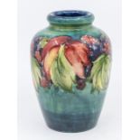 A Moorcroft leaf and berry vase, signed, approx. 15cm high. Condition: good