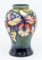 A Moorcroft Iris pattern baluster vase, signed, approx. 15cm high. Condition: good. Impressed '