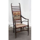 An early 20th Century stained birch and mahogany chair with shaped, upholstered and pierced splat