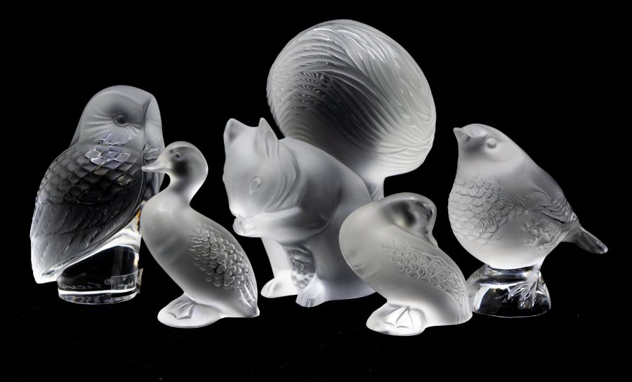 A collection of Lalique figures including squirrel, owl, bird and two ducks