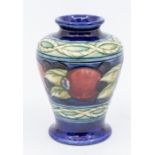 A small Moorcroft baluster vase with knot pattern and pomegranate pattern, marked to base, approx.