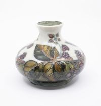 Moorcroft 'Bramble' pattern baluster vase. Height approx 10cm. No signs of damage. Crazing to the