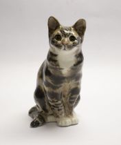 Winstanley tortoiseshell cat in the seated position. Height approx 33cm. Signature and number 7 to