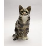 Winstanley tortoiseshell cat in the seated position. Height approx 33cm. Signature and number 7 to