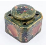 A Moorcroft inkwell and cover, made for Liberty & Co, marks to base - pomegranate pattern.