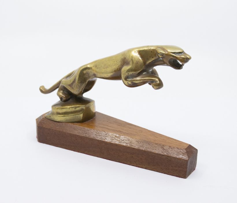 A brass car mascot modelled as a leaping Jaguar on a wooden plinth. Height approx 12.5cm, length - Image 2 of 2