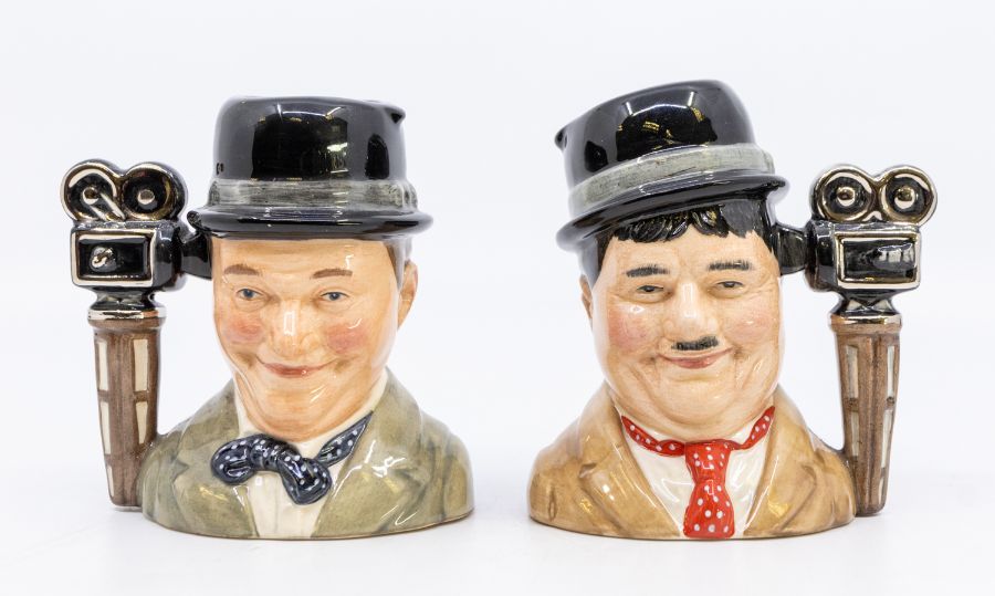 Royal Doulton: a pair of limited edition 'Laurel and Hardy' Toby Jugs, D7008 and D7009, both No. 831