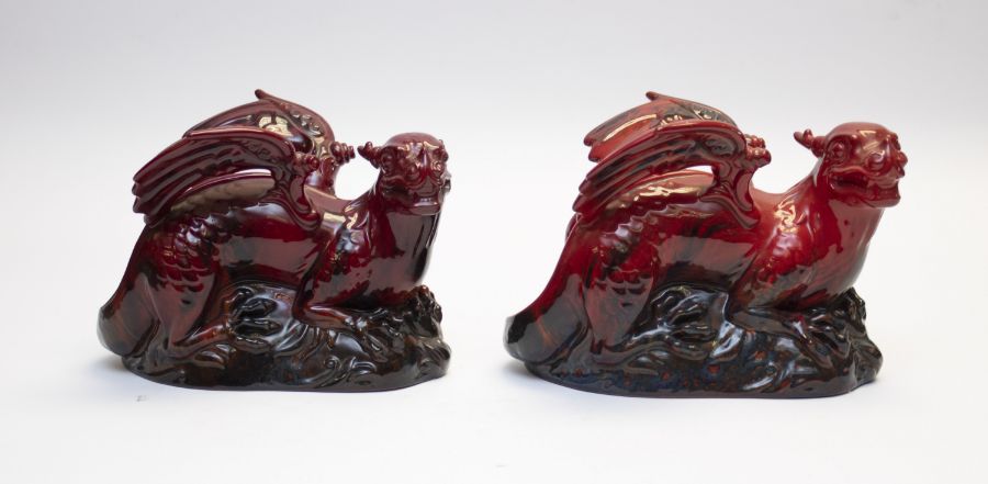 Two Royal Doulton Flambe griffins, 19cms high approx, 26cms long approx, both in good condition