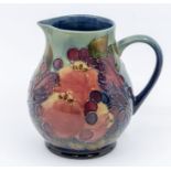 Moorcroft pottery: A Moorcroft 'Finch Blue' design jug circa 1995. Height approx 15cm. No signs of