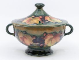 A Moorcroft berry-and-leaf patterned, lidded, two-handled bowl, approx.13cm high. Condition: good