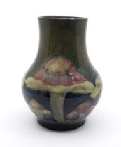 Moorcroft 'Claremont' pattern vase designed by William Moorcroft. Height approx 16.5cm. Marks to the