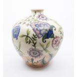 Cobridge stoneware vase with foliage decoration to the body, signed T.A. Bentley to the base