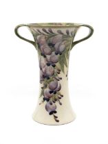William Moorcroft for Macintyre & Co 'Wisteria' pattern twin handled vase. Height approx 20.5cm.